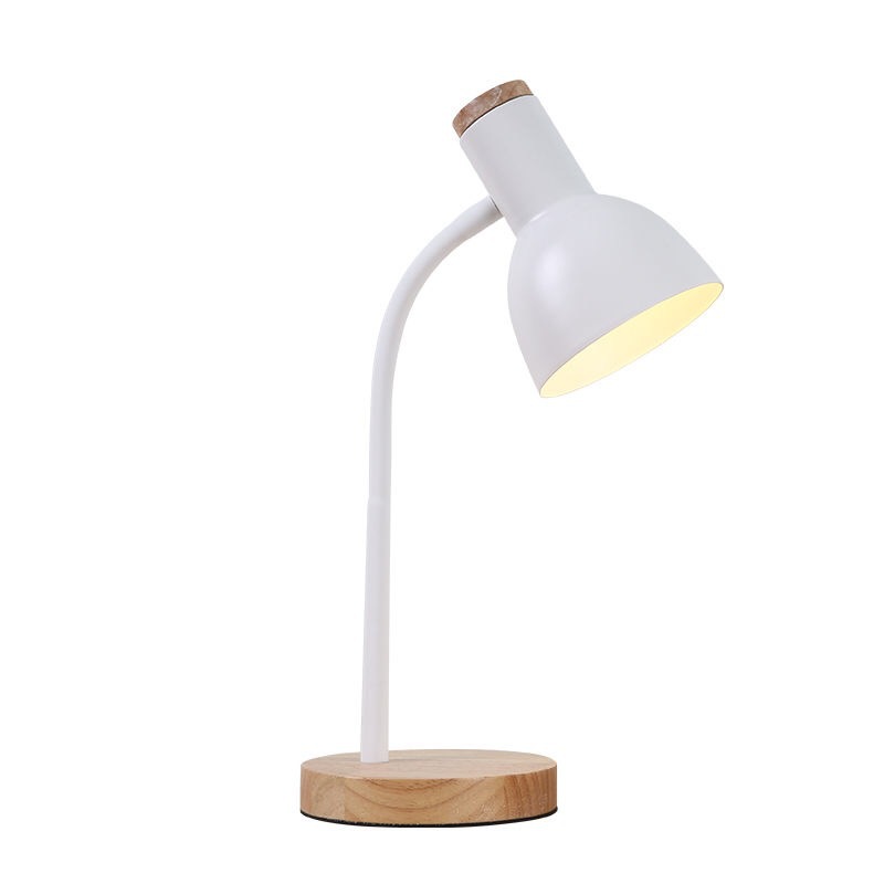 Table lamp with white shade and wooden base on a white background