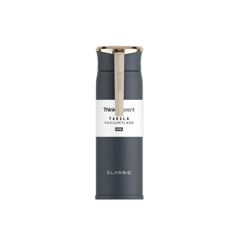Black vacuum flask with white label on a white background