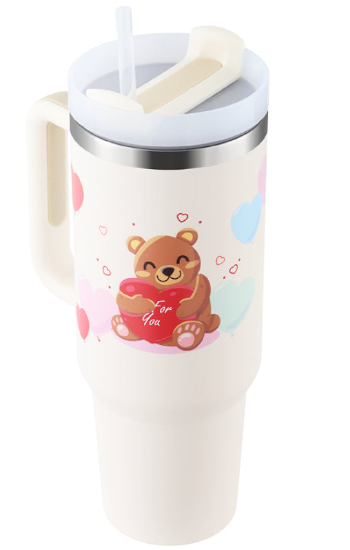 White mug with a bear design and colorful elements on a white background